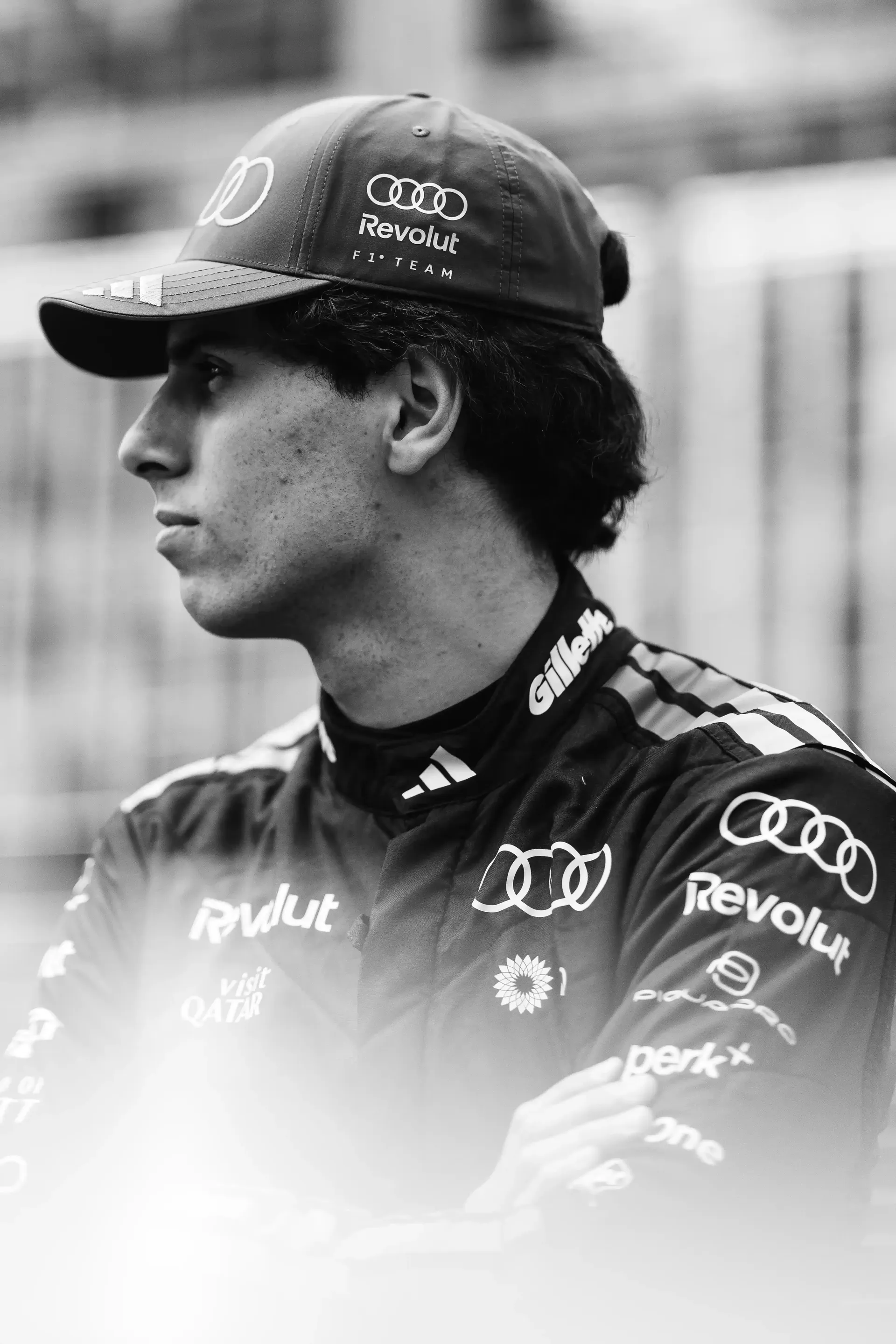 Black and White shot of  Gabriel Bortoleto driver at the Audi Revolut F1® Team standing at the side lane of the Circuite Gilles VIllneuve at the Canada Grand Prix 2026