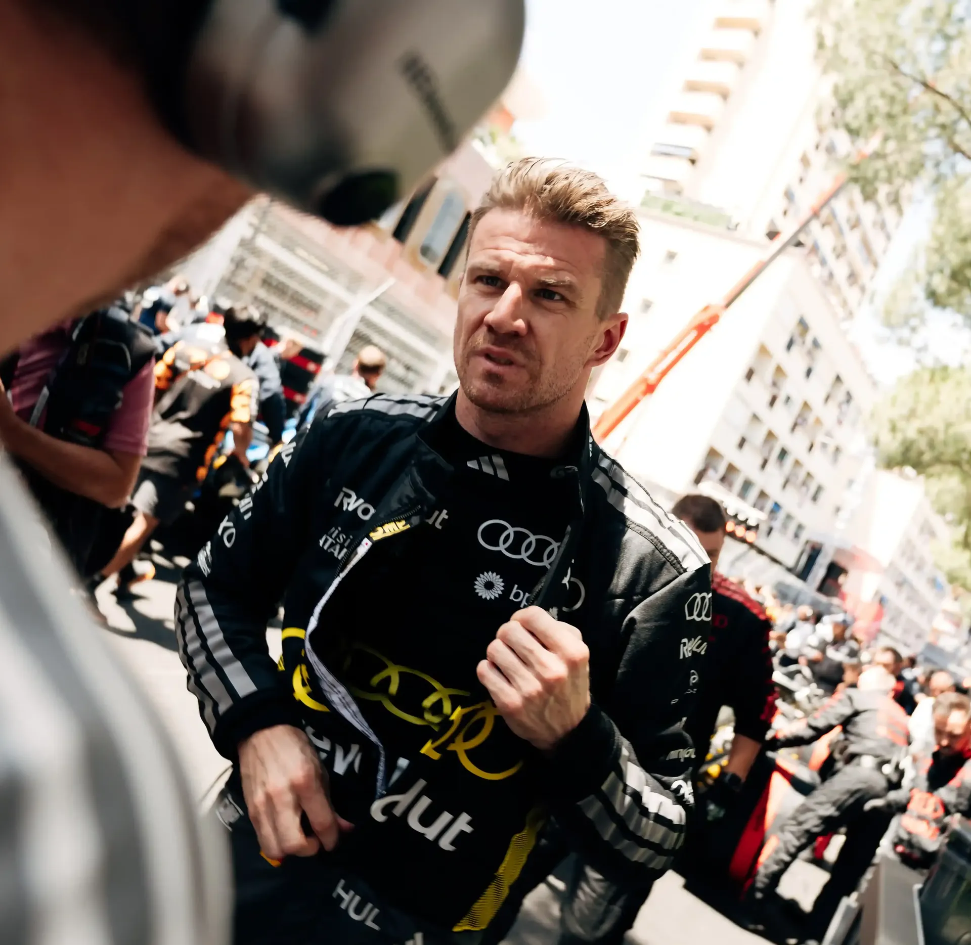 Nico Hulkenberg driver at the Audi Revolut F1® Team talks to team engineer on the racetrack of the Monaco Grand Prix 2026 